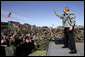President George W. Bush waves to the troops at Fort Hood, Texas, as he arrived Tuesday, April 12, 2005, to thank them in person for their service in Iraq. "Americans are grateful for your sacrifice and your service," the President told a large portion of the 44,188 soldiers and airmen stationed at the base. ".And so is your Commander-in-Chief." White House photo by Eric Draper