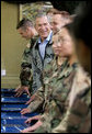 President Bush shares a meal with troops at Fort Hood, Texas Tuesday, April 12, 2005. The two divisions on base are the 1st Cavalry Division and the 4th Infantry Division. There are 44,188 soldiers and airmen stationed at the base and on an average day, there are 25,000 soldiers from Fort Hood serving outside the Continental United States. White House photo by Eric Draper