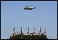 Marine One hovers above the troops at Fort Hood, Texas, as President George W. Bush arrived Tuesday, April 12, 2005. "It's an honor to be with the courageous men and women of the "Phantom Corps," the President told the troops. White House photo by Eric Draper