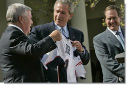 President George W. Bush jokes with New England Patriots owner Robert Kraft during a ceremony honoring the 2005 Super Bowl Champions in the Rose Garden April 13, 2005. White House photo by Eric Draper