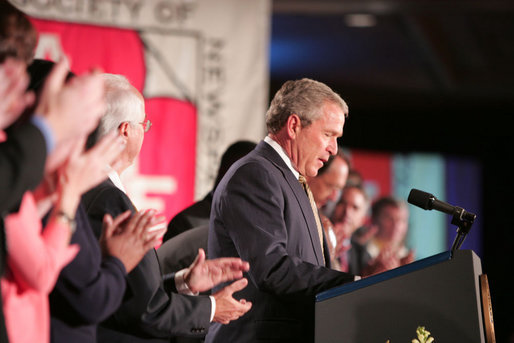 President George W. Bush receives a welcoming ovation as he arrives at the J.W. Marriott Hotel in Washington DC Thursday, April 14, 2005, to address the American Society of Newspaper Editors annual convention. White House photo by Paul Morse