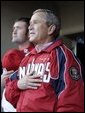 President George W. Bush during the National Anthem before throwing out the opening pitch of the Washington DC Nationals home opener at RFK Stadium in Washington DC on Thursday April 14 2005. White House photo by Paul Morse
