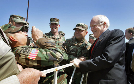 Vice President Dick Cheney poses for photos with troops during a visit to McGuire in New Jersey Friday, April 15, 2005. White House photo by David Bohrer