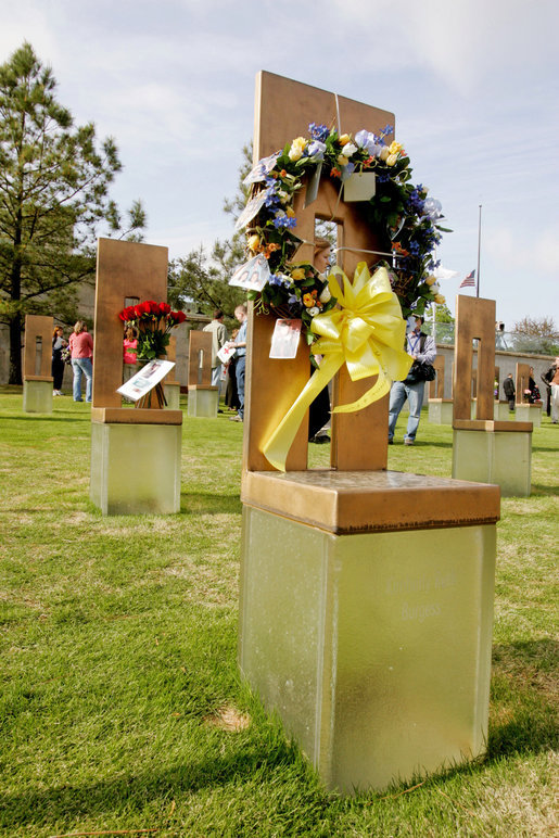 Flowers and personal items are left on several of the 168 memorial chairs at the Oklahoma City National Memorial on the 10th anniversary of the bombing of the Alfred P. Murrah Federal Building in Oklahoma City, Okla. The chairs stand in remembrance of the 168 people who died from the April 19, 1995 terrorist attack. White House photo by David Bohrer