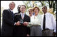 President and Mrs. Bush stand with Jason Kamras, the 2005 National Teacher of the Year, after he was honored during ceremonies in the Rose Garden Wednesday, April 20, 2005. Joining them are Secretary of Education Margaret Spellings and former students Wendall Jefferson, left, and Marco Jeter. White House photo by Eric Draper