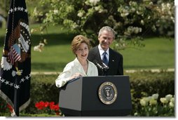 President George W. Bush looks on as he's introduced by First Lady Laura Bush Wednesday, April 20, 2005, to honor the 2005 National Teacher of the Year during ceremonies in the Rose Garden. Jason Kamras, a math teacher of eight years at John Philip Sousa Middle School in Washington, D.C., received the honors.  White House photo by Krisanne Johnson