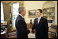 President George W. Bush welcomes Jason Kamras, the 2005 National Teacher of the Year, to the Oval Office during ceremonies Wednesday, April 20, 2005, at the White House. Mr. Kamras, a 1996 Princeton graduate, teaches seventh and eighth grade math at John Philip Sousa Middle School in Washington, D.C. "Teaching is a commitment to equity and opportunity for all children," says Mr. Kamras, who took time away from teaching in 1999-2000 to earn his Master's degree at Harvard. "It is a promise of a better future for those who have been left behind." White House photo by Eric Draper