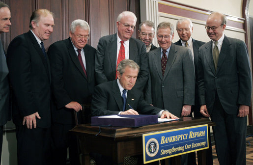  President George W. Bush signs into law S.256, the Bankruptcy Abuse Prevention and Consumer Protection Act of 2005, Wednesday, April 20, 2005, at the Eisenhower Executive Office Building. Watching on, from left are: Senator Tom Carper, D-Del.; Congressman Steve Chabot, R-Ohio; House Speaker Dennis Hastert, R-Ill.; Congressman Jim Sensenbrenner, Jr., R-Wis., Chairman of the Judiciary Committee; Senator Chuck Grassley, R-Iowa, chairman of the Finance Committee; Senator Mitch McConnell, R-Ky.; Majority Whip Senator Orrin Hatch, R-Utah, and Congressman Rick Boucher, D-Va. White House photo by Paul Morse