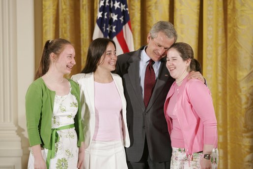 President George W. Bush congratulates ninth graders from Hawken School of Geauga County, Ohio, on receiving the President’s Environmental Youth Award in the East Room of the White House April 21, 2005. Members include, from left to right, Karoline Evin McMullen, 14, Angela Primbas, 14, and Amanda Weatherhead, 15. White House photo by Paul Morse