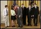President George W. Bush congratulates students of South Cache 8th and 9th Grade Center in Hyrum, Utah, on receiving the President�s Environmental Youth Award in the East Room of the White House April 21, 2005. Members include, from left to right, Parker Hellstern, 14, Tana Hellstern, 16, Aaron Lusk, 15, Bryan Miller, 14, and Jason Newhall, 14. White House photo by Paul Morse