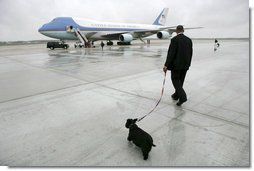 Presidential Valet Master Chief Sam Sutton escorts Barney to Air Force One prior to the President’s arrival at Andrews Air Force Base, Friday, April 22, 2005. The President will spend the weekend at his Texas ranch in Crawford after a stop in Tennessee.  White House photo by Eric Draper