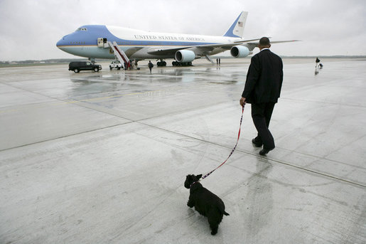 Presidential Valet Master Chief Sam Sutton escorts Barney to Air Force One prior to the President’s arrival at Andrews Air Force Base, Friday, April 22, 2005. The President will spend the weekend at his Texas ranch in Crawford after a stop in Tennessee. White House photo by Eric Draper