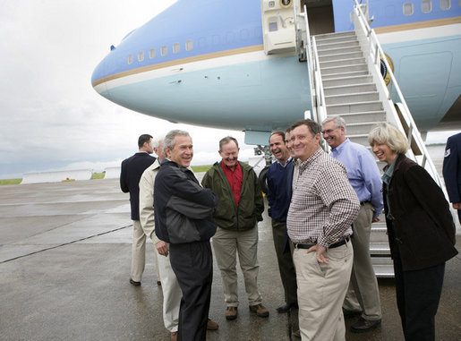 President George W. Bush shares a laugh with his congressional delegation Friday, April 22, 2005, after landing at McGhee Tyson Air National Guard Base in Knoxville. From left are Rep. John Duncan, Jr. (obstructed); Senator Lamar Alexander; Rep. Zach Wamp; Senator Bill Frist; Rep. William Jenkins; EPA Administrator Steve Johnson, and Interior Secretary Gale Norton. White House photo by Eric Draper