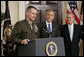 Gen. Peter Pace addresses the media as President George W. Bush and Secretary of Defense Donald Rumsfeld look on Friday, April 22, 2005. The President announced his nomination of Gen. Pace to be Chairman of the Joint Chiefs of Staff, saying, "When confirmed by the Senate, General Pete Pace will be the first Marine in history to hold this vital position. He knows the job well." White House photo by Paul Morse