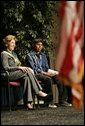 Laura Bush sits with 16-year-old Derwin Tekala, a participant in the Red Road Youth Empowerment Project, before delivering remarks at the Heard Museum in Phoenix, Ariz., April 26, 2005. Mrs. Bush discussed the role of strong family and cultural bonds in helping children resist negative social pressures. White House photo by Krisanne Johnson