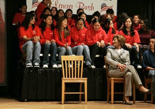 Laura Bush talks with middle school students on stage prior to delivering remarks at Sun Valley Middle School in Sun Valley, Calif., April 27, 2005. White House photo by Krisanne Johnson