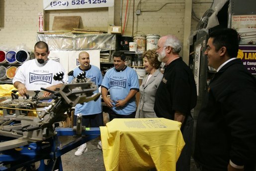 Laura Bush watches a silkscreen demonstration during a tour of Homeboy Industries in Los Angeles April 27, 2005. White House photo by Krisanne Johnson