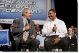 President George W. Bush talks with Yuctan Hodge, 24, during a conversation on Social Security at the James Lee Community Center, Falls Church, Va., Friday, April 29, 2005.  White House photo by Paul Morse