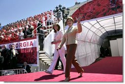 Laura Bush and Sandra Roelofs, wife of Georgian President Mikhail Saakashvili, are introduced before President Bush addresses a crowd of thousands at Freedom Square in Tbilisi, Georgia, Tuesday, May 10, 2005.  White House photo by Eric Draper