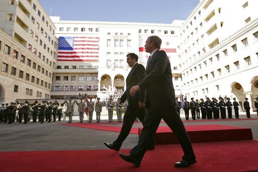 President George W. Bush walks with President Mikhail Saakashvili during an arrival ceremony in the courtyard of the Parliament Building in Tbilisi, Georgia, Tuesday, May 10, 2005. White House photo by Paul Morse