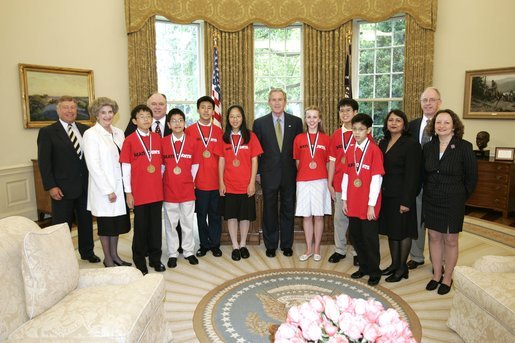 President George W. Bush meets award recipients of the 2005 MATHCOUNTS National Competition in the Oval Office Thursday, May 12, 2005. Pictured with President Bush, from left, are: Richard Johnson, vice chairman of the board for MATHCOUNTS; Claudia Allums, coach for Neal Wu; Dennis Mou, member of the first place team; Jeffrey Boyd, coach of the first place team and second place individual; Kevin Chen, member of the first place team; Mark Zhang, member of the first place team and second place individual winner; Patricia Li, semifinalist; Karlanna Lewis, semifinalist; Neal Wu, first place individual winner; Jeffrey Chan, member of the first place team; Pallavi Shah, coach of Patricia Li; Gary McDonald, chairman of the board for MATHCOUNTS and Terry King, coach of Karlanna Lewis. White House photo by Paul Morse