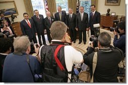 President George W. Bush poses with Presidents from Central America and the Dominican Republic in the Oval Office Thursday, May 12, 2005. From left, they are: El Salvadoran President Antonio Saca, Costa Rican President Abel Pacheco, Nicaraguan President Enrique Bolanos, Honduran President Ricardo Maduro, Guatemalan President Oscar Berger and Dominican Republican President Leonel Fernandez.  White House photo by Eric Draper