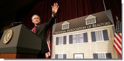 President George W. Bush waves as he arrives on stage Friday, May 13, 2005, at the Marriott Wardman Park Hotel in Washington, D.C., where he addressed the National Association of Realtors.  White House photo by Paul Morse