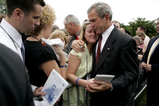President George W. Bush shares a quiet moment with guests after the Annual Peace Officers' Memorial Service at the U.S. Capitol on Sunday, May 15, 2005. White House photo by Krisanne Johnson