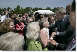 President George W. Bush meets some of the audience members at West Point, Va., Monday, May 16, 2005. White House photo by Eric Draper
