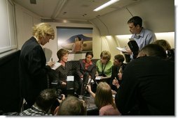 Laura Bush talks with members of the press pool aboard Air Force One during a flight to Amman, Jordan, Thursday, May 19, 2005. White House photo by Krisanne Johnson