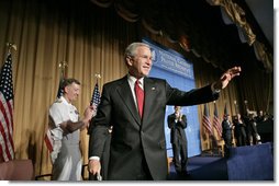 President George W. Bush waves after speaking at the National Catholic Prayer Breakfast in Washington, D.C., Friday, May 20, 2005.  White House photo by Eric Draper