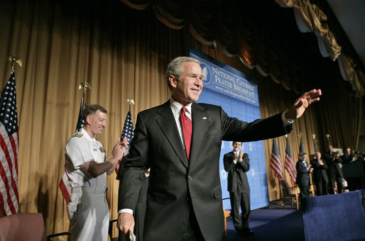 President George W. Bush waves after speaking at the National Catholic Prayer Breakfast in Washington, D.C., Friday, May 20, 2005. White House photo by Eric Draper