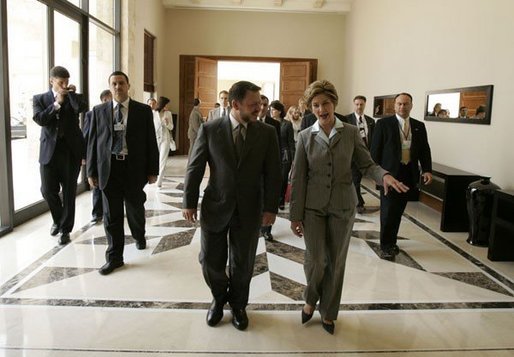 Laura Bush walks with King Abdullah II following a meeting at the Dead Sea in Jordan, Saturday, May 21, 2005. White House photo by Krisanne Johnson