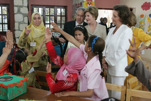Laura Bush and Suzanne Mubarak, wife of Egyptian President Hosni Mubarak, listen to a classroom lesson at the Girl Friendly School in the Abou Sir neighborhood of Cairo, Egypt, Monday, May 23, 2005. The National Council for Children and Motherhood built the school to provide education for girls living in remote and rural areas. White House photo by Krisanne Johnson