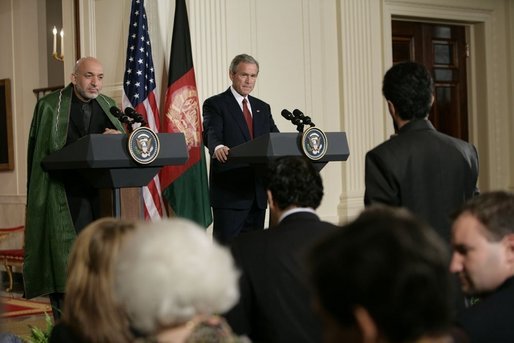 President George W. Bush and Afghan President Hamid Karzai field a question from a reporter Monday, May 23, 2005 in the East Room of the White House. White House photo by Eric Draper
