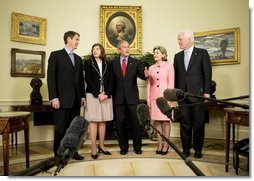 President George W. Bush is joined by Texas Senators Kay Bailey Hutchison, second from right, and John Cornyn, right, and Senate Leader Bill Frist (R-Tenn.), as they stand with Judge Priscilla Owen Tuesday, May 24, 2005, in the Oval Office.  White House photo by Eric Draper
