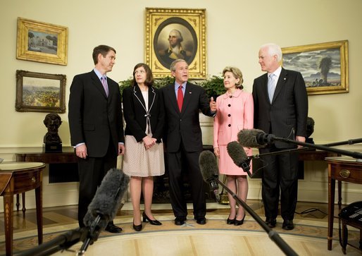 President George W. Bush is joined by Texas Senators Kay Bailey Hutchison, second from right, and John Cornyn, right, and Senate Leader Bill Frist (R-Tenn.), as they stand with Judge Priscilla Owen Tuesday, May 24, 2005, in the Oval Office. White House photo by Eric Draper