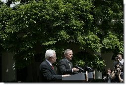 President George W. Bush and President Mahmoud Abbas of the Palestinian Authority, respond to questions during a joint press availability Thursday, May 26, 2005, in the Rose Garden of the White House.  White House photo by Eric Draper