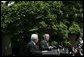 President George W. Bush and President Mahmoud Abbas of the Palestinian Authority, respond to questions during a joint press availability Thursday, May 26, 2005, in the Rose Garden of the White House. White House photo by Eric Draper