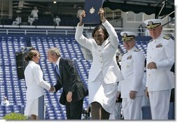 A U.S. Naval Academy graduate yells for joy after receiving her diploma in Annapolis, Md., Friday, May 27, 2005.  White House photo by Paul Morse