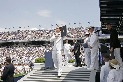 After addressing the Midshipmen and their families, President George W. Bush greets each graduate as they receive their diplomas during the U.S. Naval Academy graduation in Annapolis, Md., Friday, May 27, 2005. White House photo by Paul Morse