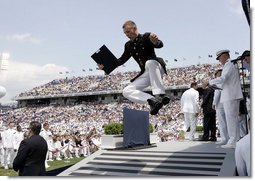 A U.S. Naval Academy graduate celebrates after receiving his diploma in Annapolis, Md., Friday, May 27, 2005.  White House photo by Paul Morse