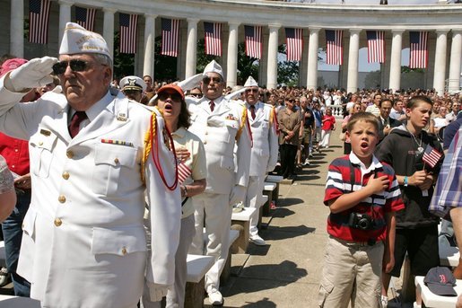 Thousands stand for the National Anthem during a Memorial Day ceremony at Arlington National Cemetery in Arlington, Va., May 30, 2005. White House photo by Krisanne Johnson