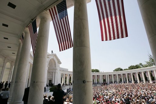 Thousands of people gather to pay their respects on Memorial Day at the amphitheatre in Arlington National Cemetery in Arlington, Va., May 30, 2005. White House photo by Paul Morse