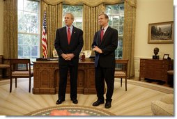 President George W. Bush stands with Rep. Christopher Cox, his nominee for Chairman of the Securities and Exchange Commission, Thursday, June 2, 2005, in the Oval Office. Said the President of the Congressman, "As a champion of the free enterprise system in Congress, Chris Cox knows that a free economy is built on trust."  White House photo by Eric Draper