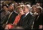 President George W. Bush, Laura Bush and HUD Secretary Alphonso Jackson, pictured at right, listen to performers during the White House reception honoring June as Black Music Month in the East Room Monday, June 6, 2005. White House photo by Paul Morse