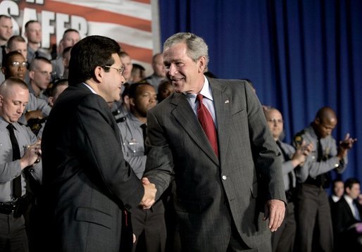 President George W. Bush thanks Attorney General Alberto Gonzales after speaking about the Patriot Act at the Ohio State Highway Patrol Academy in Columbus, Ohio, Thursday, June 9, 2005. White House photo by Eric Draper