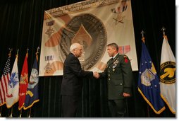 Vice President Dick Cheney awards U.S. Army Chief Warrant Officer Four David Smith the Distinguished Flying Cross during the Heroism Awards Ceremony at the Davis Conference Center, MacDill Air Force Base, in Tampa, Fla., Friday, June 10, 2005.  White House photo by David Bohrer