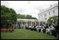 President George W. Bush addresses 200 exchange students from the program in the Rose Garden Monday, June 13, 2005. Living with host families for one year, the students come from mostly Muslim countries. "I think your generation is going to help shape one of the most exciting periods of history in the broader Middle East and the world," said the President. "It's a period of time when the hope of liberty is spreading to millions." White House photo by Eric Draper
