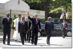 President George W. Bush walks with the Presidents from Botswana, Ghana, Namibia, Mozambique and Niger along West Executive Avenue at the White House Monday, June 13, 2005. President Bush and the African leaders met in the Oval Office before delivering a statement about AGOA to the press in the Dwight D. Eisenhower Executive Office Building.  White House photo by Eric Draper